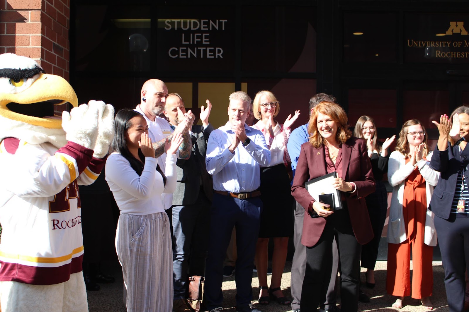 Chancellor Carrell speaking to audience in front of Student Life Center after ribbon cutting. 