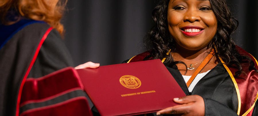 A female UMR graduate grabs a diploma