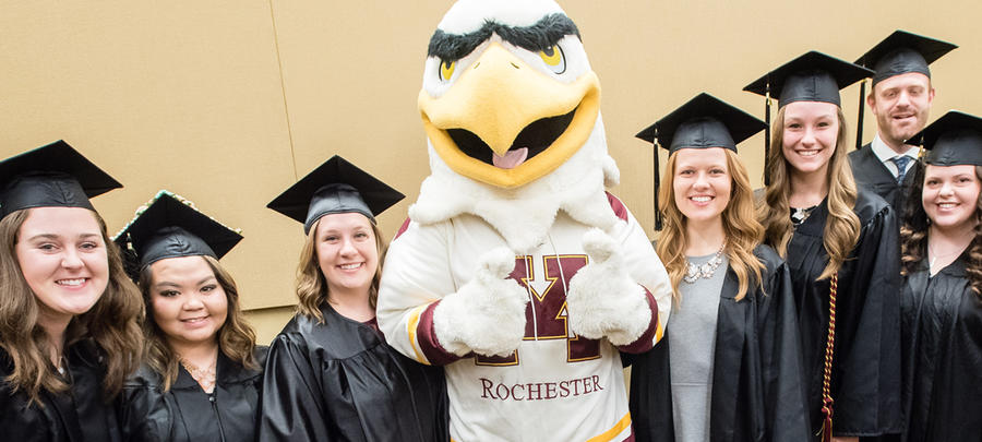 Rockie with graduates