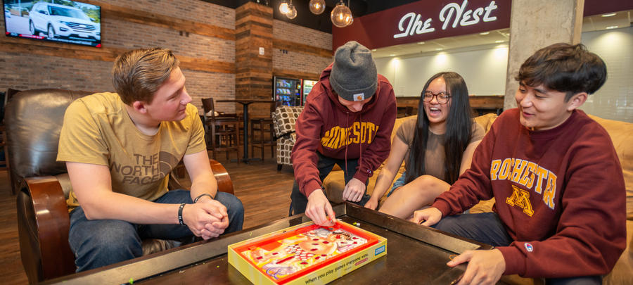 UMR students playing a board game at the Nest