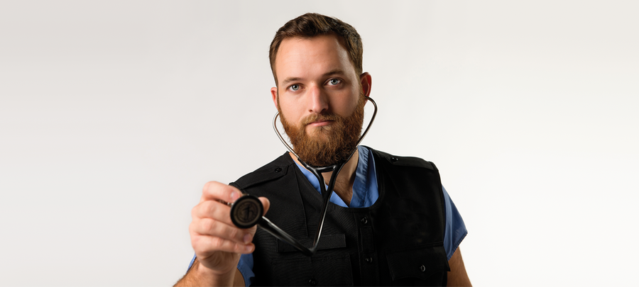 Zach Domeier, UMR Alumnus 2013, leans forward with a stethoscope around his neck.Photo of 
